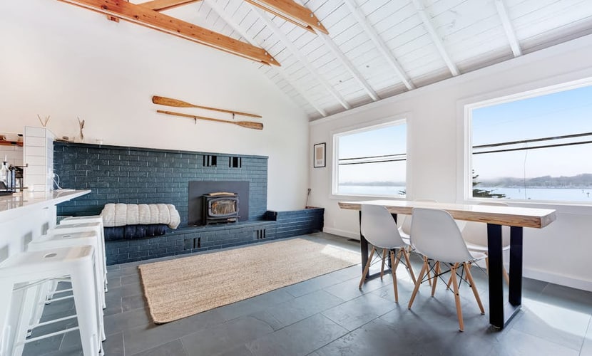 Eucalyptus and salt air fill the deck overlooking Bodega Harbor — surf breaks and dog-friendly beaches about a mile up or down Highway 1. This surf-inspired bungalow offers a private sauna for post-beach relaxation and space for four guests plus your dogs. Walk to Huria's Pizza in one minute or Spud Point Crab Company in 10. The harbor seals call from the rocks below — you're home on the Sonoma Coast.