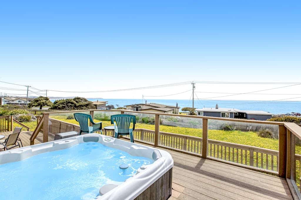 Salt air mingles with the scent of wildflowers as you soak in your private hot tub, the Pacific stretching endlessly before you. This dog-friendly cottage sits directly across from Carmet Beach — your pups can join you for morning walks on the sand. Room for 8 in three bedrooms. Just 3 miles from Bodega Bay's legendary Spud Point crab sandwiches and 1.2 miles from Salmon Creek Beach. The rhythm of the waves becomes your soundtrack here on the wild Sonoma Coast.