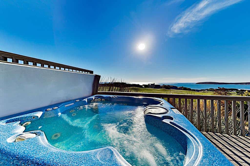 Soak in your private hot tub as the sun sets over Bodega Bay, then retreat to the cedar sauna for total relaxation. This 5-bedroom home perches above The Links golf course with sweeping ocean views from nearly every room. Room for 10 guests across three levels. Just a 10-minute walk to Doran Beach's protected sands and 5 minutes to the golf course. Mornings here start with coffee on the deck, watching the fog lift to reveal the Pacific stretching endlessly before you.