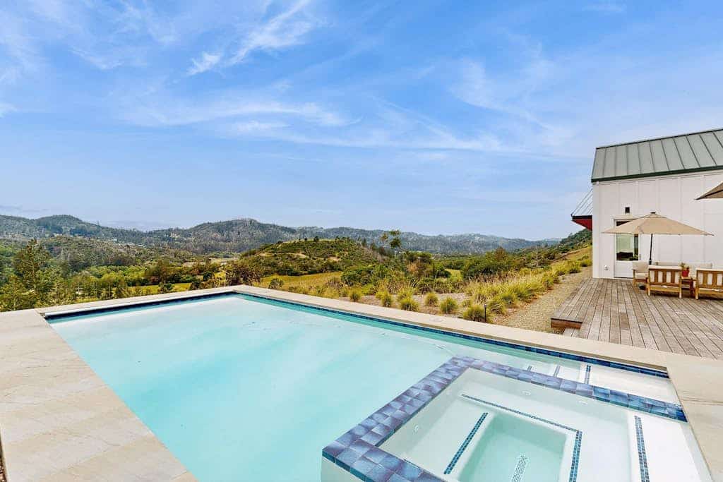 Wake to vineyard light spilling across the wraparound deck of this single-level hilltop home in gated Calistoga country, with a private pool and hot tub overlooking the valley. Three king suites — each with its own bath — sleep 6, just 1.5 miles from Tom Eddy Winery and 4 miles to Calistoga's Lincoln Avenue hot springs.