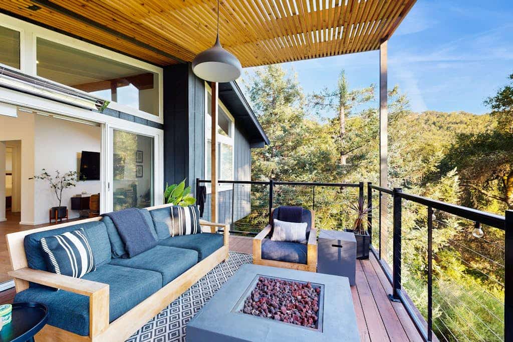 Step onto your private dock and watch the Russian River slide past while oak-covered hillsides frame the view. Two stacked units — each with its own entrance, patio, and bathroom — make this riverfront stay work for two couples or a family of four. A bocce court, big yard, and canoe wait outside, and downtown Healdsburg's wineries and fine dining are 2.4 miles away.