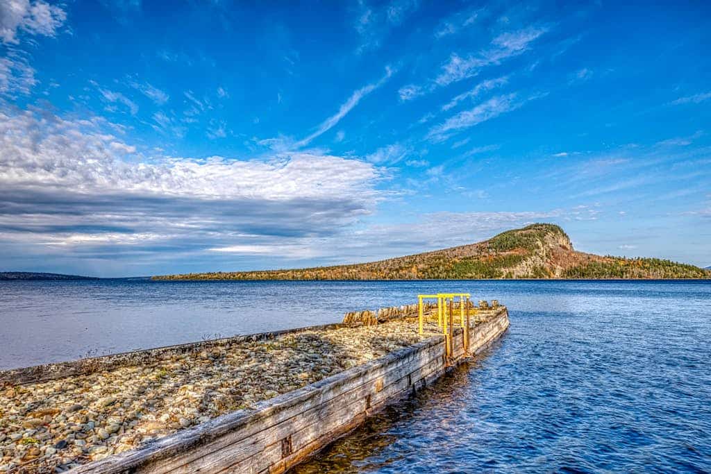 Charming condo w/ lake access, dock, WiFi & mountain views