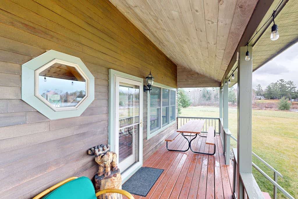 Cozy, dog-friendly waterfront cabin with large yard, porch, dock, & lake views