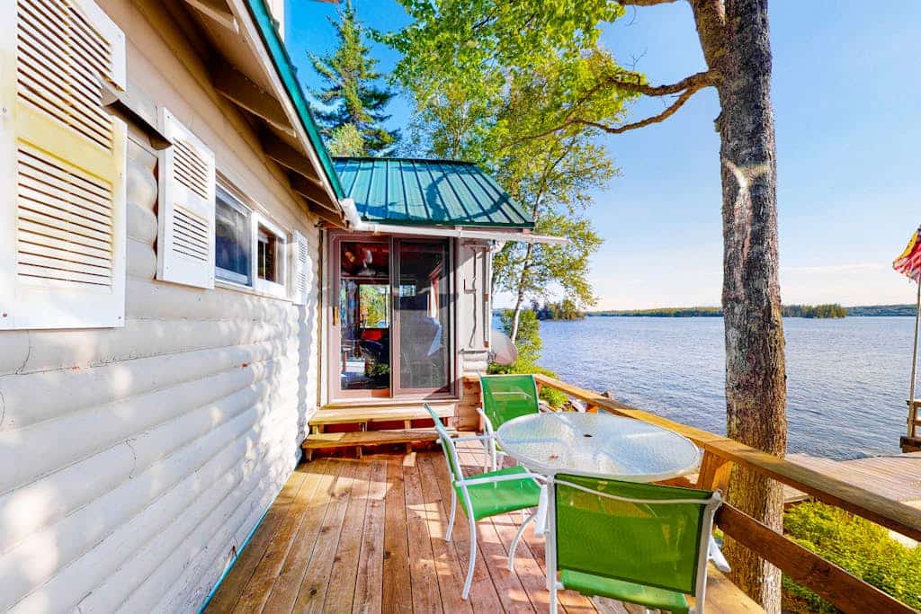 Vintage lakefront cabin with incredible water views, private dock & pebble beach