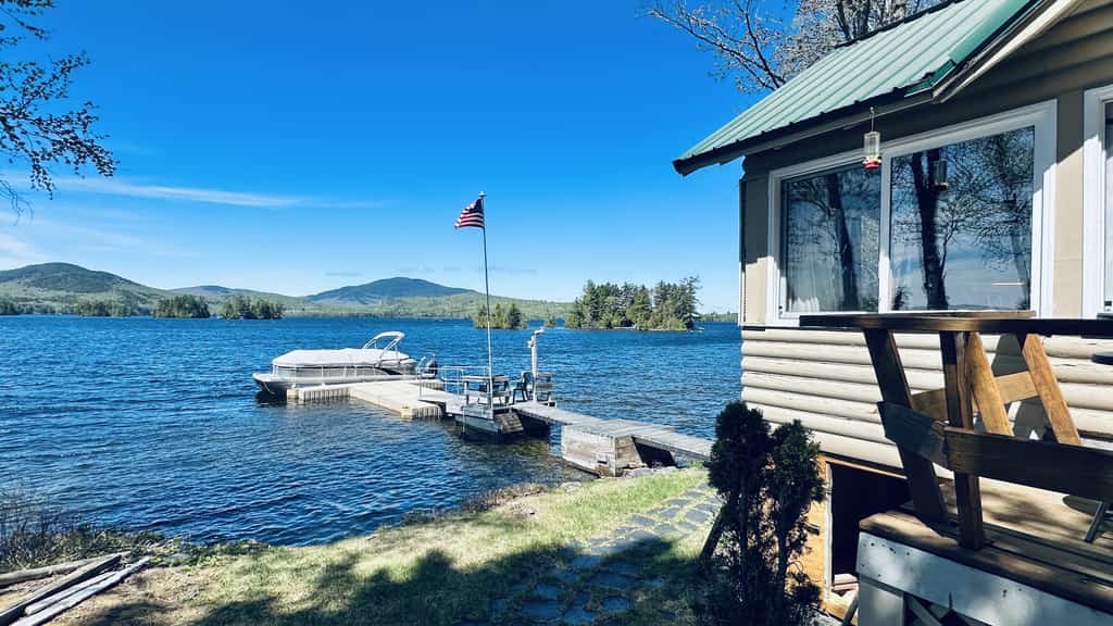 Vintage lakefront cabin with incredible water views, private dock & pebble beach