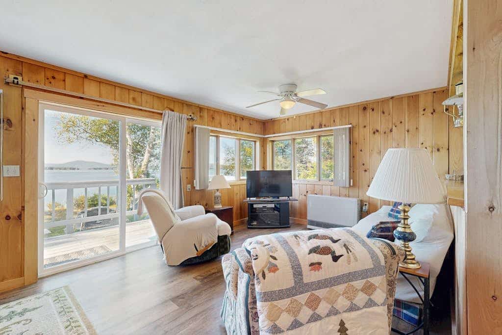 Lakefront home with private dock, mooring, pebble beach, grill, & firepit