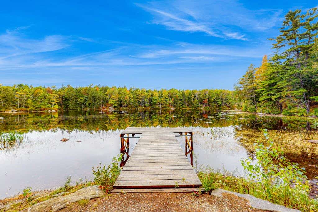 Appalachee Pond Waterfront Cottage | Decks, Sunroom, Dock with Kayaks & Canoe