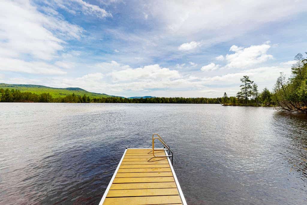 Lakefront home with private dock, canoe & kayak, fast WiFi, and firepit - dog OK