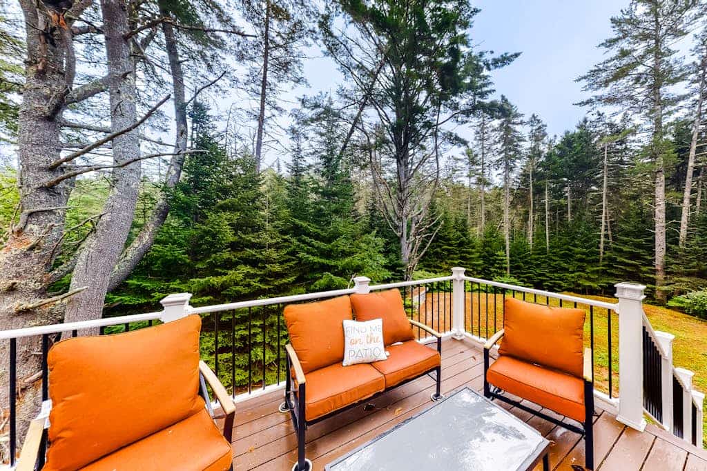 Idyllic waterfront home with furnished deck, grill, sweeping views & private W/D