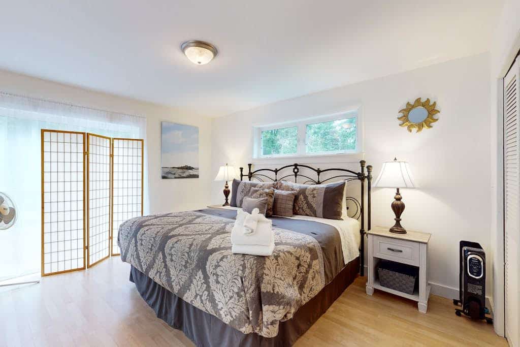 Sunny coastal retreat with deck, grill, beach, dock, & ocean access