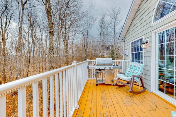 Lake-view two-story home with beach access, wood stove, grill, W/D, & fast WiFi