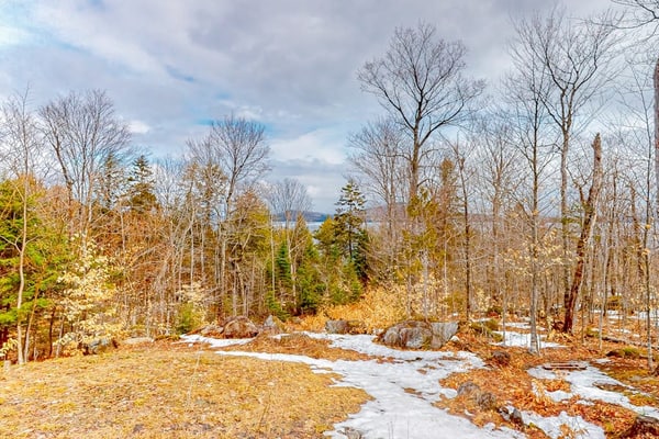 Lake-view two-story home with beach access, wood stove, grill, W/D, & fast WiFi