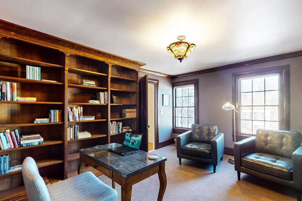 Elegant Victorian Gothic Revival home with wet bar, sunroom, & washer/dryer