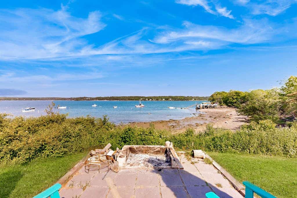 Clark Cove- Oceanfront home with dock, beautiful deck & firepit - steps to the beach