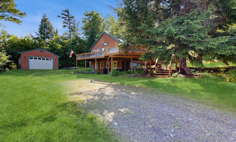 Scenic retreat with a spacious deck, gas fireplace, and glimpses of Moosehead Lake