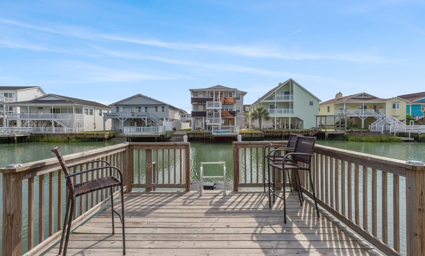 Welcome to the Blushing Mermaid, a charming three bedroom beach house located right on the inlet and just a short walk from the sand in Cherry Grove. Designed for comfort, connection, and coastal relaxation, this spacious getaway features one king bed, two queen beds, two twin beds, and a sleeper sofa, comfortably accommodating up to 12 guests. With beautiful inlet views and all the comforts of home, it is the perfect place for your family or group to create lasting beach memories.