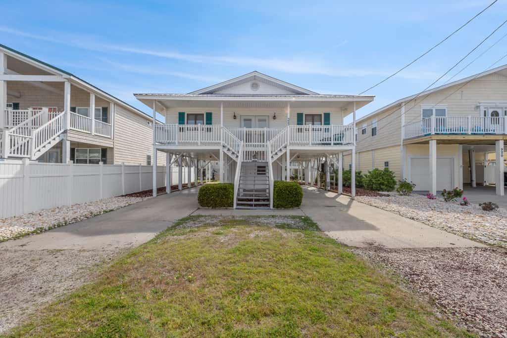 Welcome to the Blushing Mermaid, a charming three bedroom beach house located right on the inlet and just a short walk from the sand in Cherry Grove. Designed for comfort, connection, and coastal relaxation, this spacious getaway features one king bed, two queen beds, two twin beds, and a sleeper sofa, comfortably accommodating up to 12 guests. With beautiful inlet views and all the comforts of home, it is the perfect place for your family or group to create lasting beach memories.