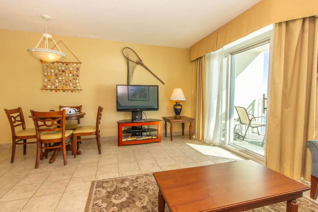 Check out this homey 1 bedroom oceanfront condo, tucked away on the 7th floor of the Carolinian Resort. It's furnished with two full-sized beds and a sleeper sofa, so it can comfortably sleep up to six guests, making it a great spot for a family vacation or a beachy escape with friends.