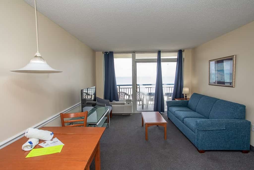 Check out this direct oceanfront vacation rental at Boardwalk Resort in Myrtle Beach, SC. This oceanfront vacation rental is fully furnished with everything you need for your next vacation. This 1 bedroom apartment features 2 full beds, 1 full-size wall bed, a sleeper sofa, and will comfortably accommodate 8 guests. This rental is a true 1-bedroom condo, and our guests enjoy the separation between rooms and the privacy that is offered.