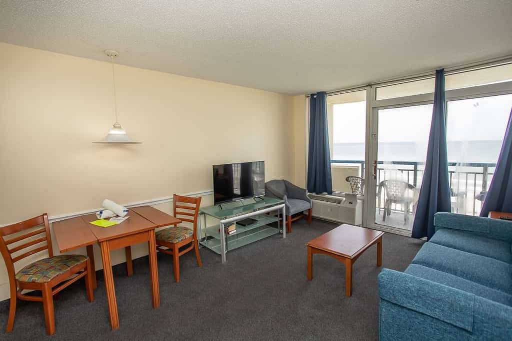 Check out this direct oceanfront vacation rental at Boardwalk Resort in Myrtle Beach, SC. This oceanfront vacation rental is fully furnished with everything you need for your next vacation. This 1 bedroom apartment features 2 full beds, 1 full-size wall bed, a sleeper sofa, and will comfortably accommodate 8 guests. This rental is a true 1-bedroom condo, and our guests enjoy the separation between rooms and the privacy that is offered.