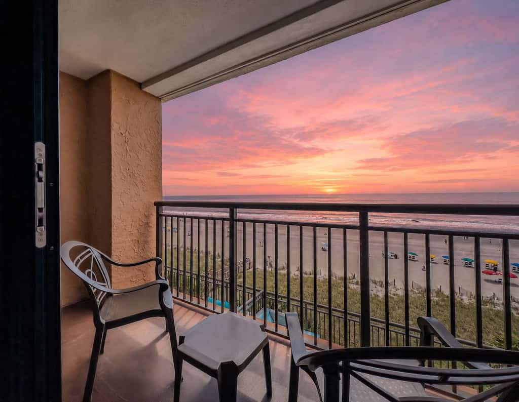 Enjoy breathtaking oceanfront views at the Caravelle Resort in Myrtle Beach! This fully updated 6th-floor King-suite features fresh paint, new flooring, brand-new mattresses, updated furniture, a new TV, modern appliances, and more. The private entrance offers added convenience and privacy, making it feel like a home away from home. With all the comforts of a hotel room but more spacious, this oceanfront retreat is perfect for your next beach getaway!