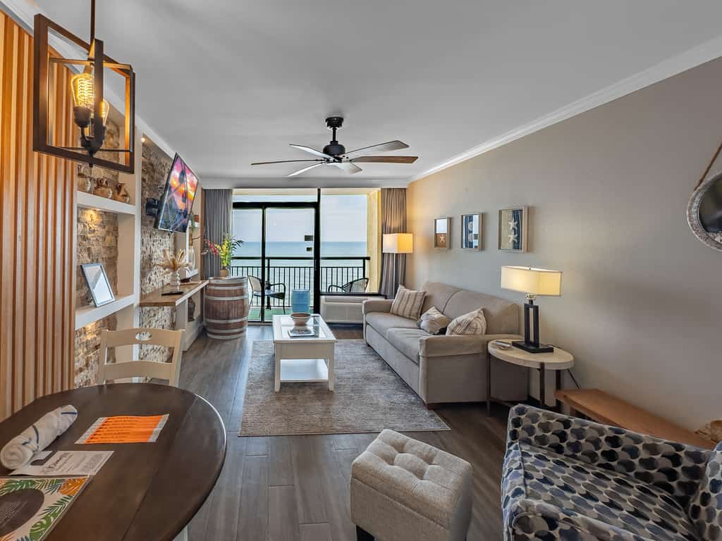 Check out this truly unique and beautifully renovated oceanfront one-bedroom condo at Caravelle Resort. This coastal escape is thoughtfully designed with comfort in mind, featuring two queen beds in the bedroom, along with a sleeper sofa and a Murphy bed in the living area, comfortably accommodating up to eight guests.
