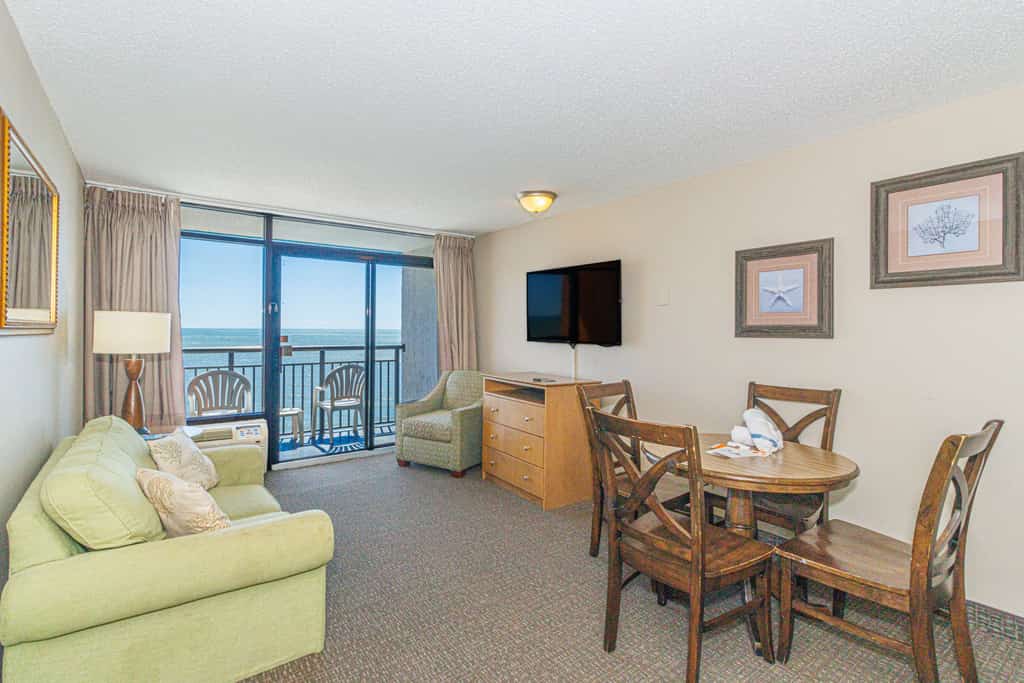 The search for your next vacation stops here! Check out this 15th floor, oceanfront condo at the Landmark Resort in Myrtle Beach. This 1-bedroom suite is fully furnished with 2 full beds, 1 full size murphy bed, and will comfortably accommodate 6 guests. This condo offers a spacious living space with a love seat, TV, a small dining table with chairs, and beautiful oceanfront views from the private balcony right off the living area.