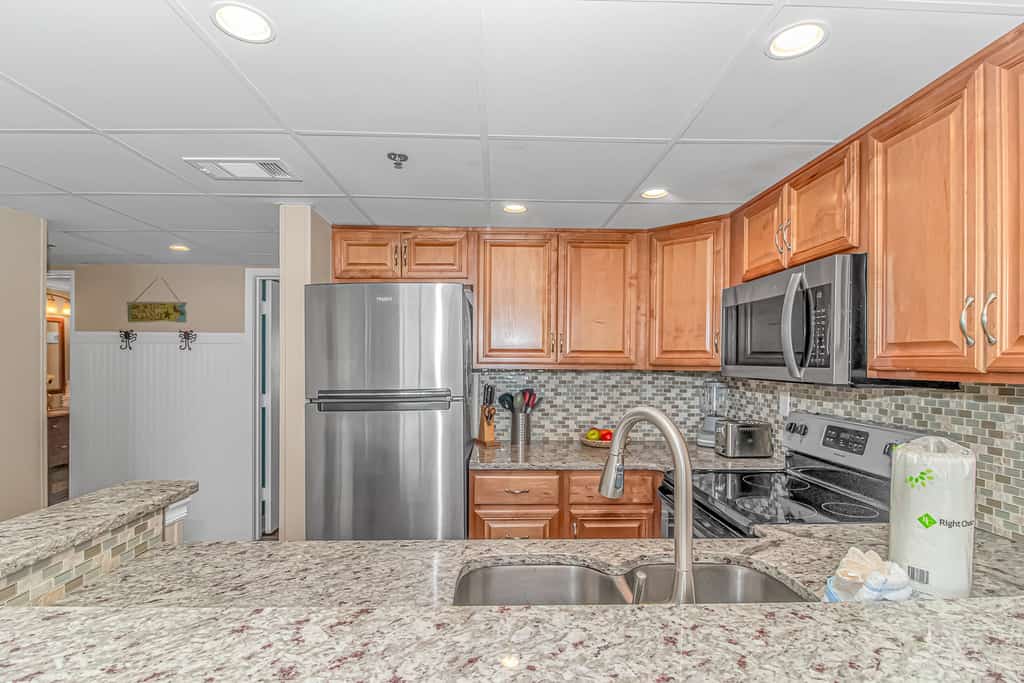 Check out this adorable one bedroom oceanview condo perched on the 10th floor of the Sand Dunes Resort. This peaceful beach getaway features one queen bed and one full bed, comfortably accommodating up to four guests and providing the perfect place to relax after a day by the ocean.