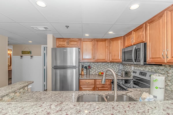 Check out this adorable one bedroom oceanview condo perched on the 10th floor of the Sand Dunes Resort. This peaceful beach getaway features one queen bed and one full bed, comfortably accommodating up to four guests and providing the perfect place to relax after a day by the ocean.