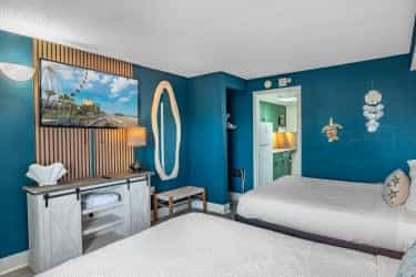 Looking for a recently remodeled, first-floor vacation rental with breathtaking views? Boardwalk 135 is your ideal coastal getaway, beautifully reimagined with marine wildlife as its inspiration, and positioned right on the oceanfront! This stunning condo is thoughtfully designed to comfortably accommodate up to 6 guests, featuring two queen-sized beds and a queen sleeper sofa, making it the perfect home base for your Myrtle Beach adventure.