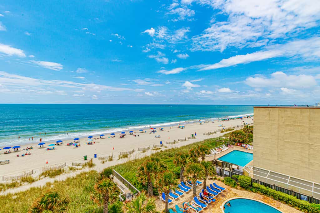 This fourth-floor studio welcomes you with a sweeping view of the ocean and pool, an instant reminder that you&rsquo;ve arrived at your very own slice of Myrtle Beach paradise. Sunlight fills the space, reflecting off the water below and setting the tone for slow mornings, salty breezes, and carefree days. Whether you're planning a romantic escape or a peaceful retreat for two, this cozy studio offers the perfect balance of comfort and charm. With a queen bed and a full-size sleeper sofa, it can easily accommodate up to four guests when needed, without ever losing its intimate feel.