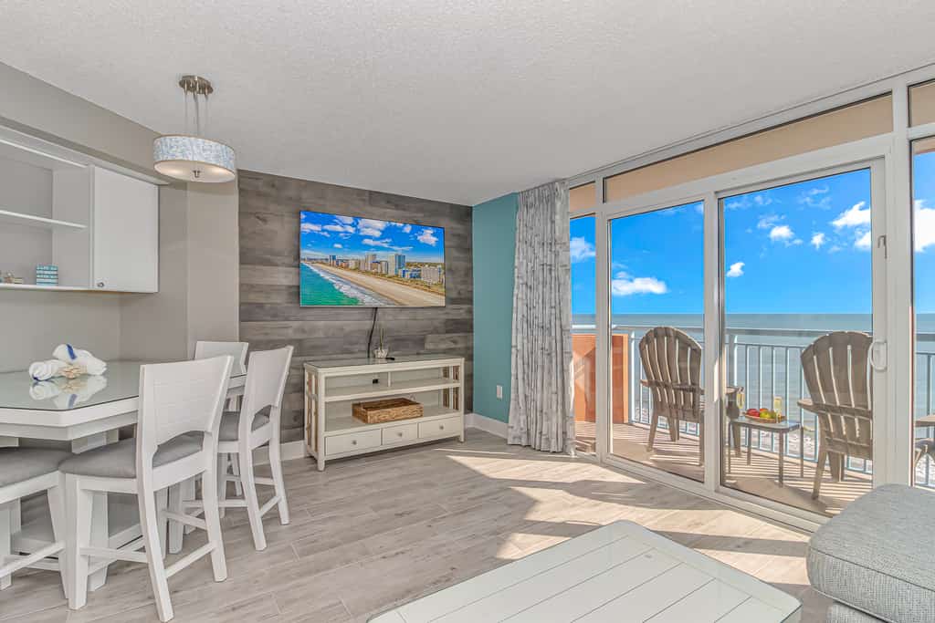 The search for your next vacation stops here! Check out this 8th floor, direct ocean front, beautifully updated condo at the Roxanne Towers Resort in Myrtle Beach. This 1 bedroom suite is fully furnished with 1 king bed and 1 sleeper sofa.. This unique layout offers an oversized living space with a large couch, TV with cable, a small dining table with chairs, and beautiful direct ocean front views from the private balcony right off the living area. This layout features an open floor plan making the space feel bigger and not cramped!