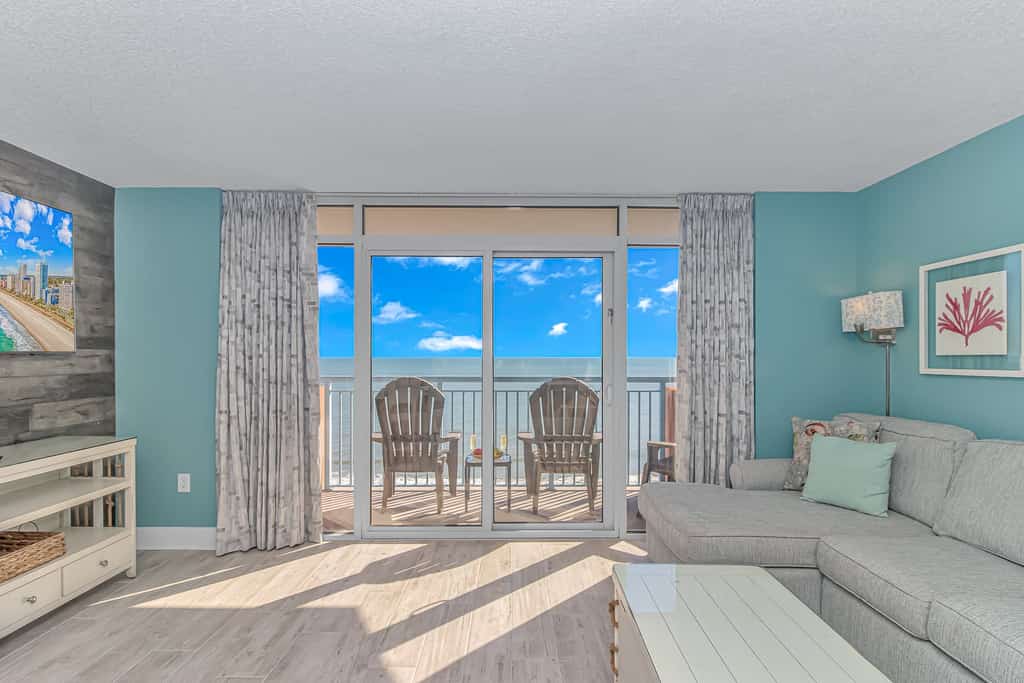 The search for your next vacation stops here! Check out this 8th floor, direct ocean front, beautifully updated condo at the Roxanne Towers Resort in Myrtle Beach. This 1 bedroom suite is fully furnished with 1 king bed and 1 sleeper sofa.. This unique layout offers an oversized living space with a large couch, TV with cable, a small dining table with chairs, and beautiful direct ocean front views from the private balcony right off the living area. This layout features an open floor plan making the space feel bigger and not cramped!