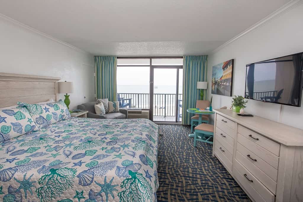 If you're looking for an updated vacation rental, perfect for 2 guests, look no further! Check out this 4th floor king suite at the Sand Dunes Resort in Myrtle Beach, SC. This ocean front studio is fully furnished with 1 king bed, accent chair, dresser and closet for storage, dining table and chairs, TV with basic cable, resort wifi, private bathroom with tub/shower and vanity, fridge, kitchen sink, and more! The space is perfect for a couple's getaway!


Important Notice: Balcony Railing Coating Project

The Balcony Railing Coating Project will be underway for approximately 6&ndash;8 weeks (weather permitting), with completion expected by mid to late January.

During this period, signage will be placed on sliding glass doors to inform guests when balcony work is taking place. Please remind guests not to touch the railings, as they will be in various stages of coating and drying.

Please note:

Balcony access will be restricted only while work is being performed on that specific stack.