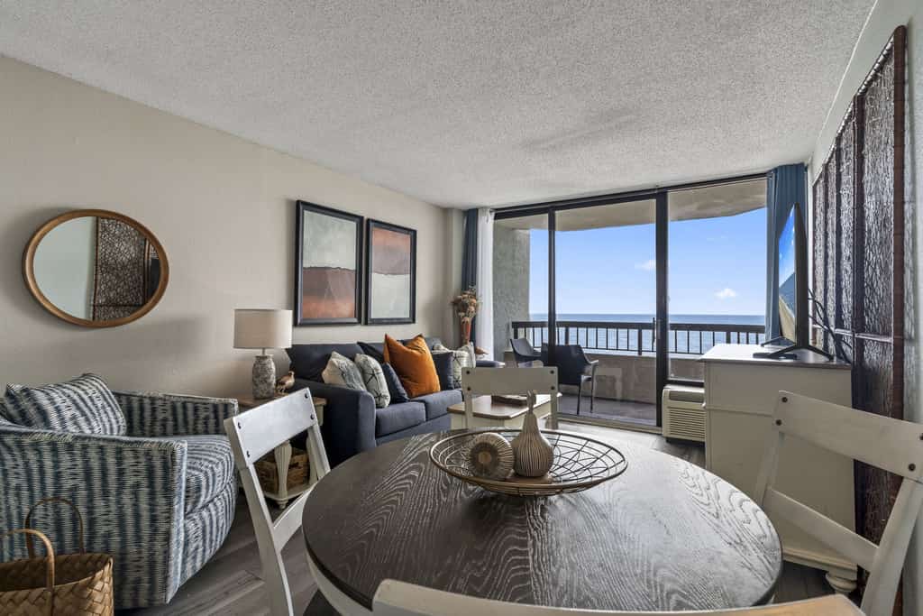 Located at the beautiful Pinnacle Oceanfront Tower Resort in Myrtle Beach, this stunning 1-bedroom suite offers front-row views of the Atlantic that will instantly put you in vacation mode. Perched perfectly on the 7th floor, the condo feels bright, open, and thoughtfully designed, complete with 2 queen beds, a sleeper sofa, and a queen-sized Murphy bed, giving up to 8 guests plenty of space to relax without ever feeling cramped.