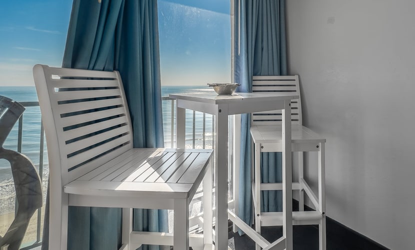 This is an 11th floor suite at the Sand Dunes Resort in Myrtle Beach, SC. This ocean front apartment is fully furnished with 2 queen beds, dresser and closet for storage, TV with basic cable, complimentary wifi, private bathroom with tub or shower and vanity, and a fully functioning kitchen. In addition to the beautiful, modern updates inside, this condo has its own private balcony with table and chairs from which past guests have enjoyed spotting dolphins and watching beautiful sunsets!