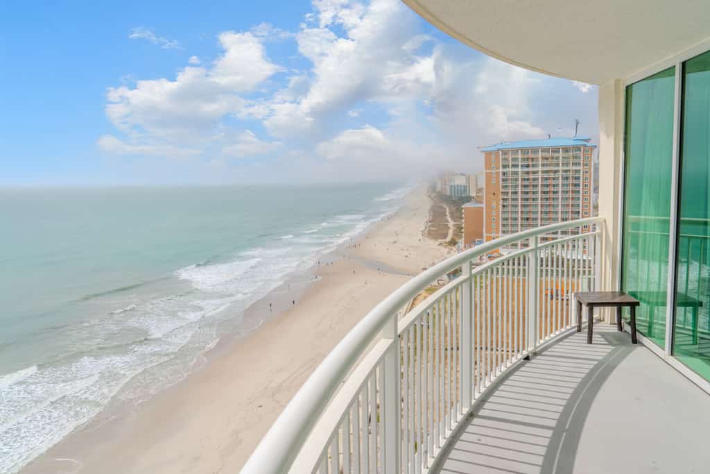 This beautiful 2-bedroom, 2-bathroom oceanfront condo at Sandy Beach Resort in Myrtle Beach is truly a gem. With sweeping, direct views of the Atlantic Ocean from an expansive private balcony, this space is perfect for relaxing and enjoying all the coast has to offer. Whether you're here with family, friends, or as a couple, the condo comfortably sleeps 6 to 8 guests with a king bed, two queen beds, and a queen sleeper sofa.
