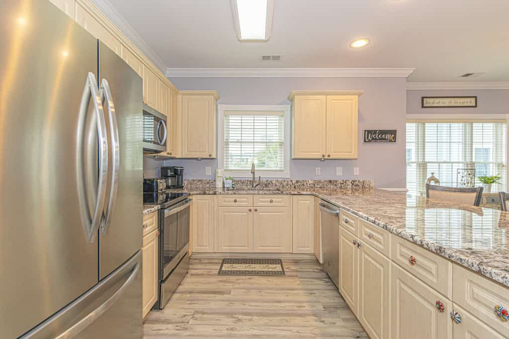 Your next vacation starts here! Nestled in the heart of Myrtle Beach, this charming second-floor condo at Magnolia Pointe is the perfect getaway. With three cozy bedrooms, this fully furnished condo comfortably sleeps up to six guests. You&rsquo;ll find two queen-sized beds, two twin-sized beds, and plenty of space to unwind. The spacious living area boasts a large L-shaped sectional, an accent chair, a sleek wall-mounted TV, a coffee table, and stunning views of the lush golf course right from the private balcony, an ideal spot to relax and enjoy the scenery.