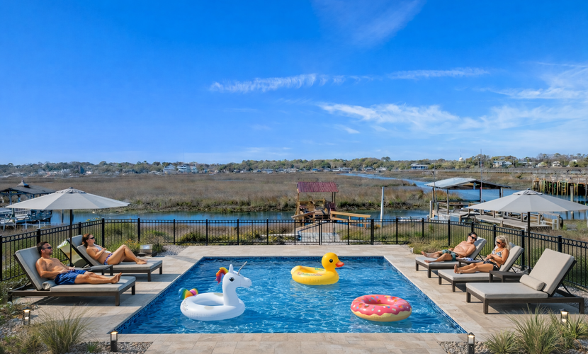 Welcome to Mystic C’s, a stylish five bedroom inlet side escape designed for unforgettable group getaways. With tall balconies overlooking the water, arcade games, and a brand new in ground pool, this spacious home offers the perfect setting for your next beach vacation. Thoughtfully furnished with two king beds, three queen beds, two twin beds, one twin with a twin trundle, and a queen sleeper sofa, the home comfortably accommodates up to 16 guests. It's important to note that the photos of the pool are purely renderings. The pool is expected to be complete by May 1, 2026.