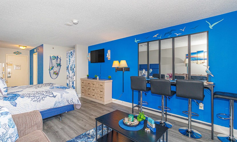 This beautiful ocean view studio, located at the Sea Mist Resort in the Driftwood Tower, offers the perfect getaway. The condo features one king-sized bed and a queen-sized sleeper sofa, comfortably accommodating up to 4 guests. Whether you’re here for a quick retreat or an extended stay, you’ll feel right at home.
Smoking AND Vaping are not allowed.
Unfortunately, all pools are currently unavailable for guest use with no anticipated reopening date.