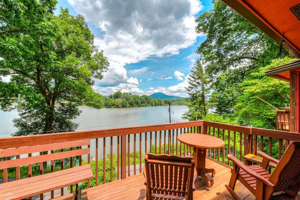 Upper unit lakefront home with lake views, wood fireplace, shared outdoor pool