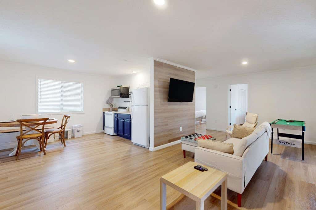 Updated tree-lined cabin with mountain view, and screened-in deck.