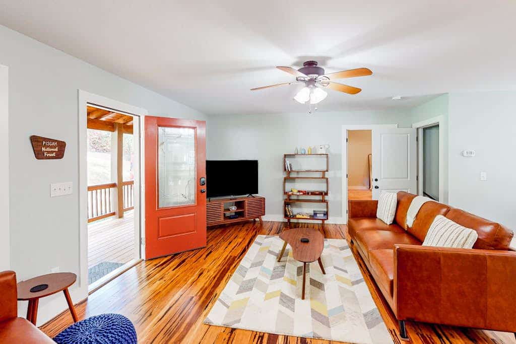 Scenic retreat with private hot tub, fenced yard, fire table, & furnished porch