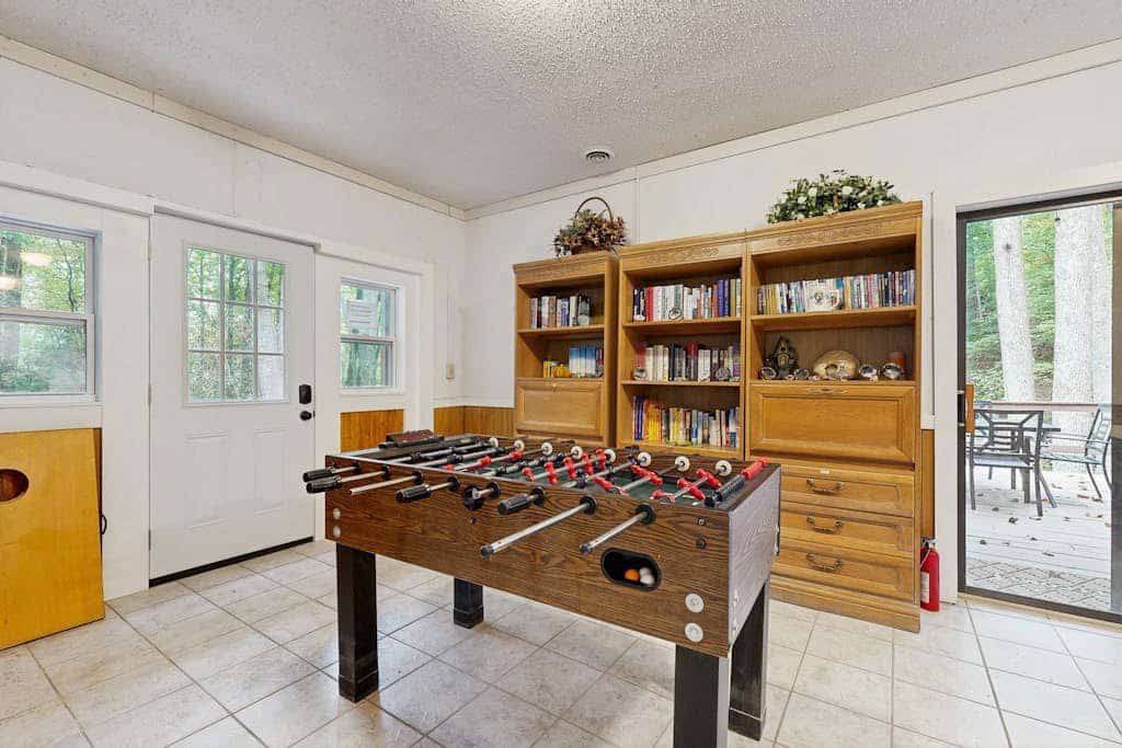Mountain home nestled in the forest with a stream, deck, firepit, & game room