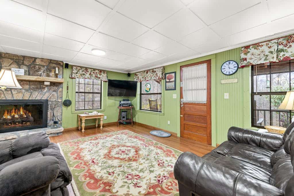 Charming acreage with a grill, W/D, large porch, and wood-burning fireplace