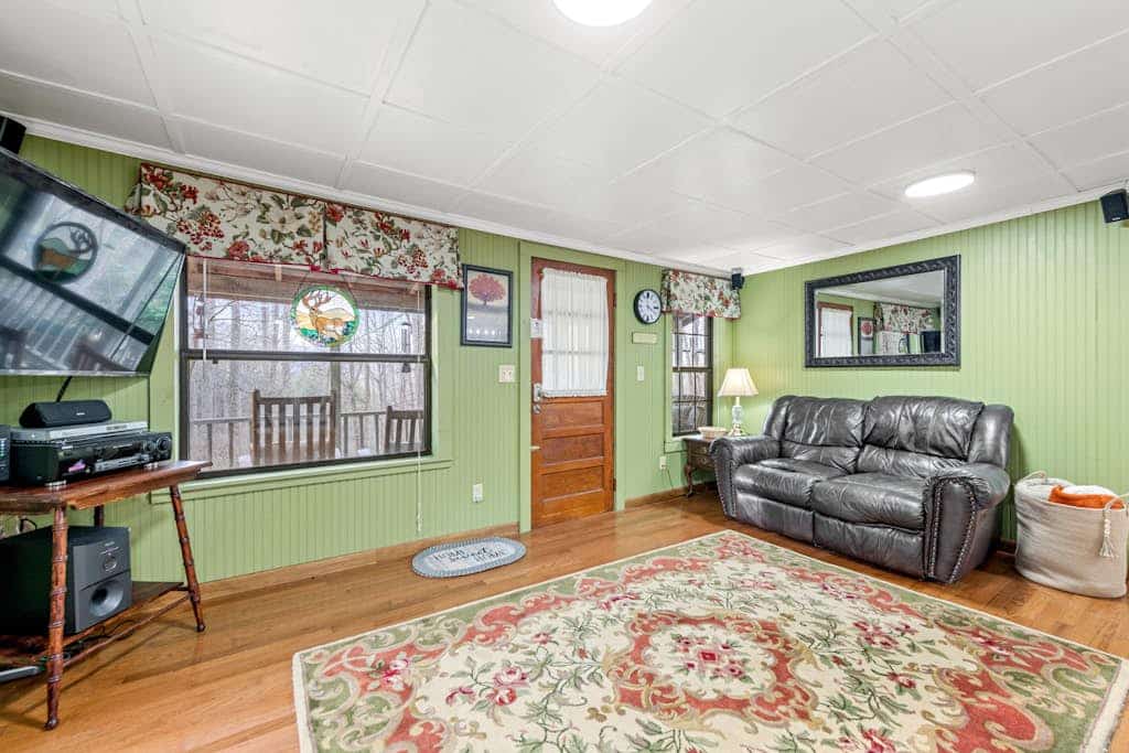 Charming acreage with a grill, W/D, large porch, and wood-burning fireplace