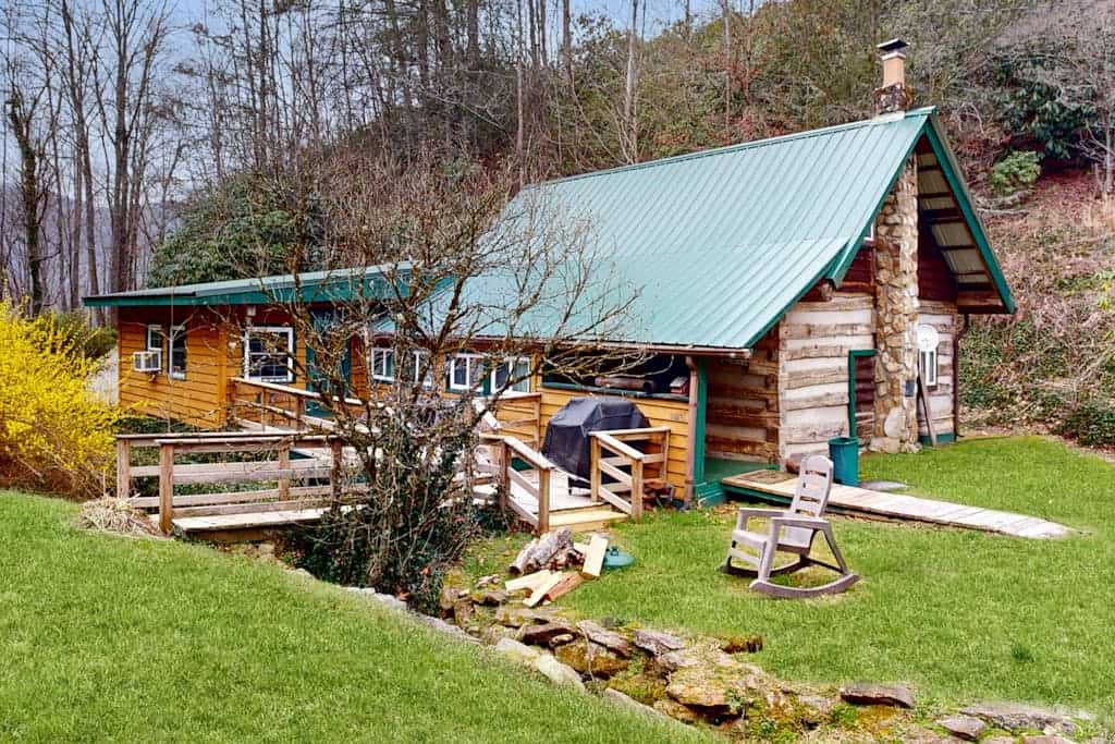 Historic, private log cabin w/ deck, fireplace & wood stove - one dog OK