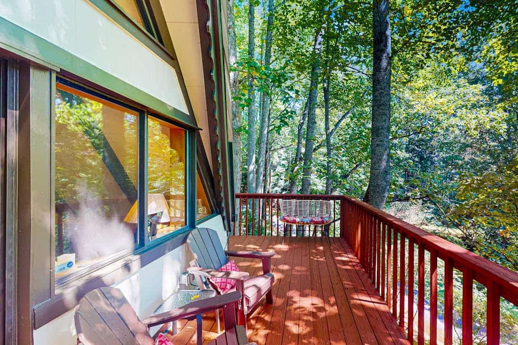 Spacious, dog-friendly A-frame cabin with a furnished deck, gas fireplace, & AC
