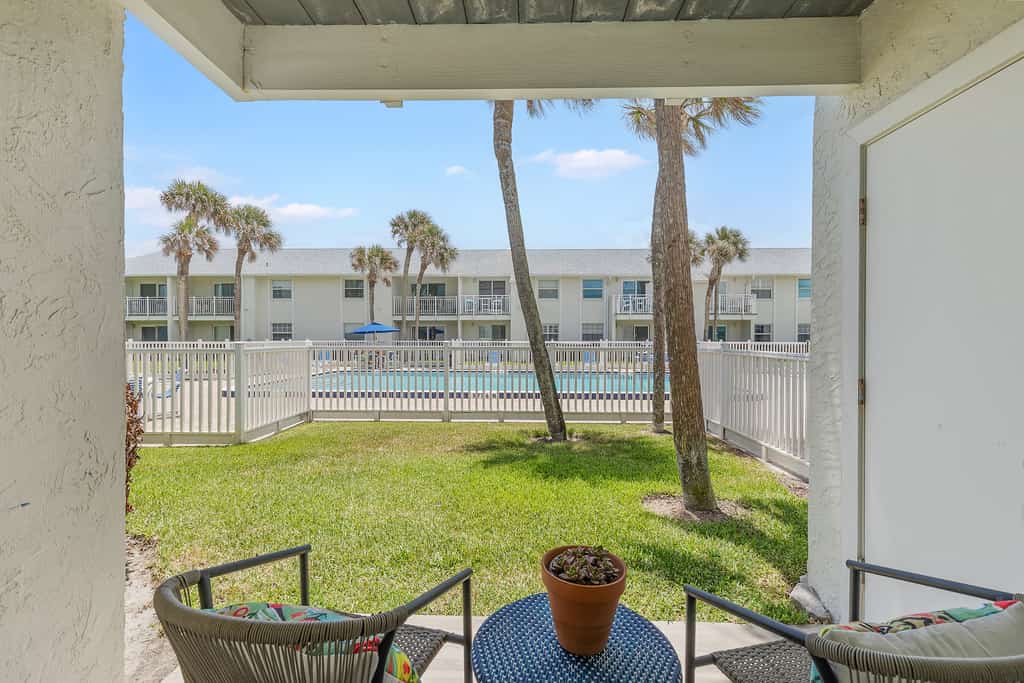 Relaxing King Suite with Poolside Patio & Partial Ocean Views