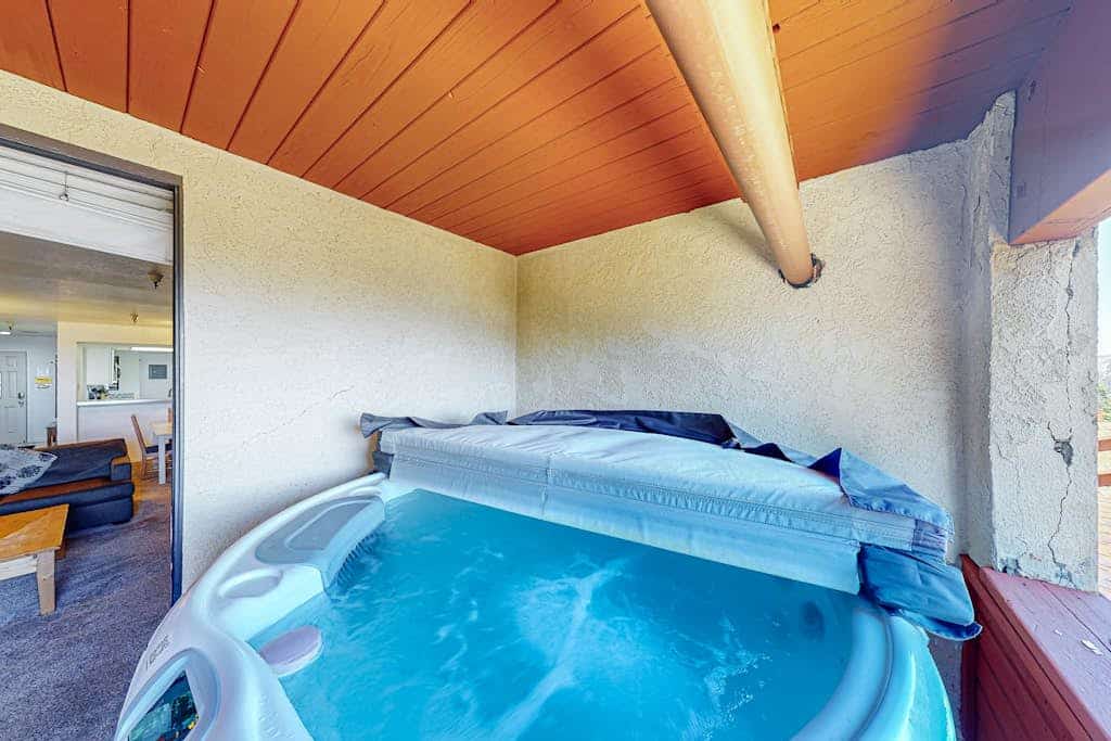 Ski-in/out condo with mountain view, private hot tub, deck & fireplace
